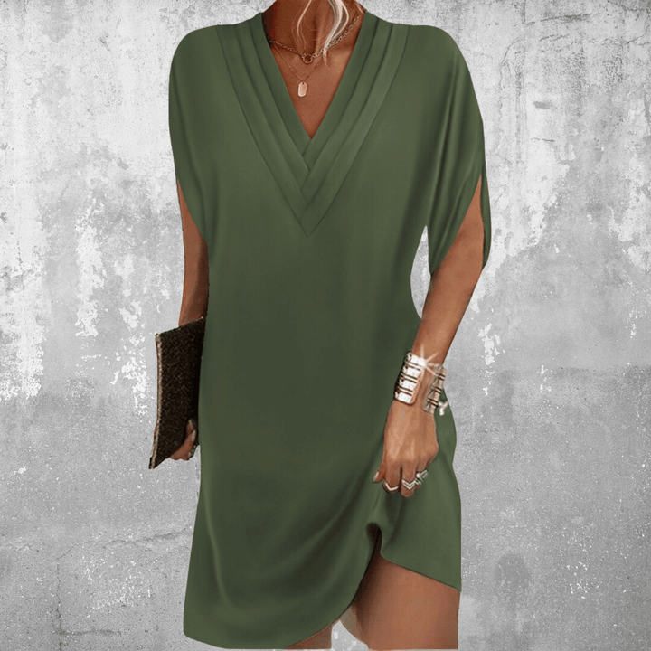 Women's V-neck mini dress with elegant flowy sleeves. A chic summer casual or party dress with a relaxed fit.