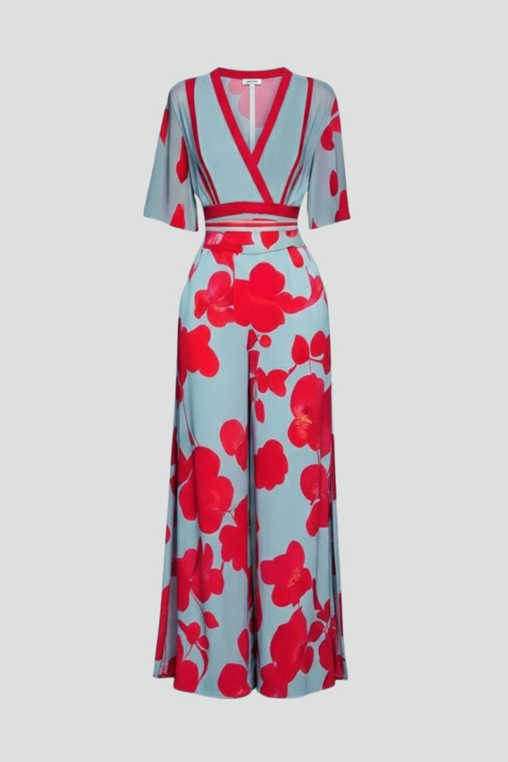 Flowy printed maxi dress for women, featuring a V-neck, flutter sleeves, and elegant silhouette for special occasions.