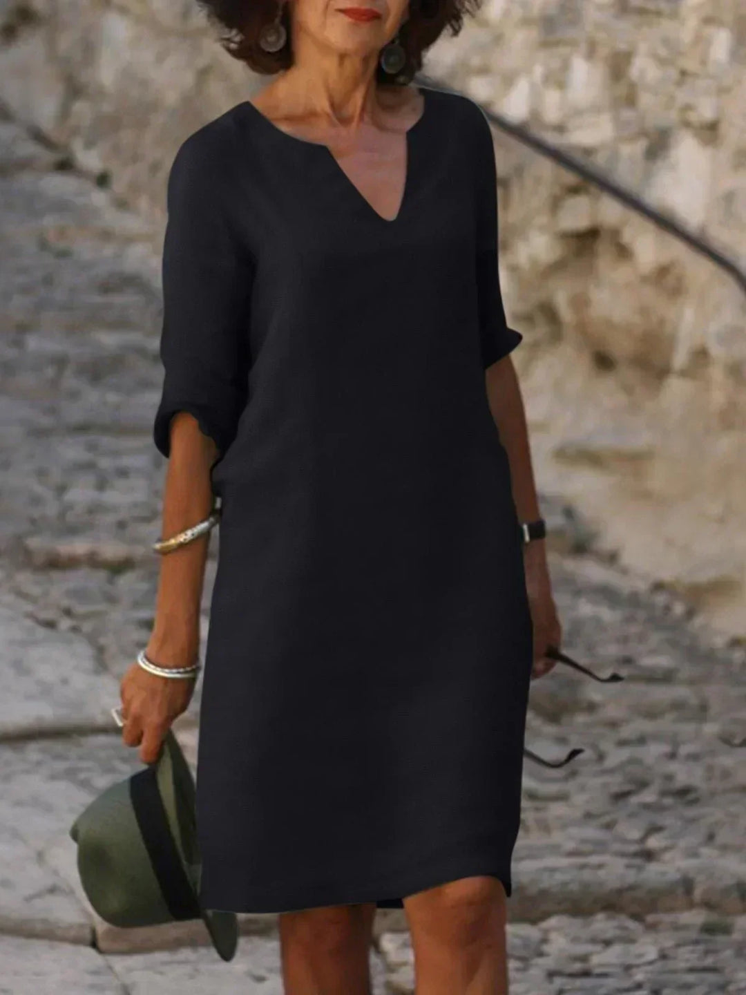 Versatile women's midi dress, v-neck, three-quarter sleeves, relaxed fit. Great for day to night & travel.