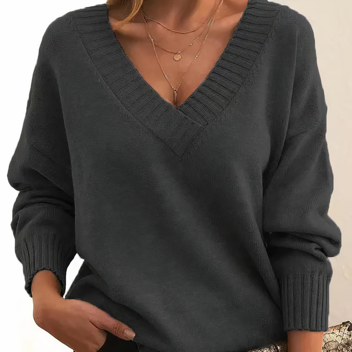 Versatile women's V neck sweater with ribbed knit. Relaxed fit, long sleeve for everyday fashion.