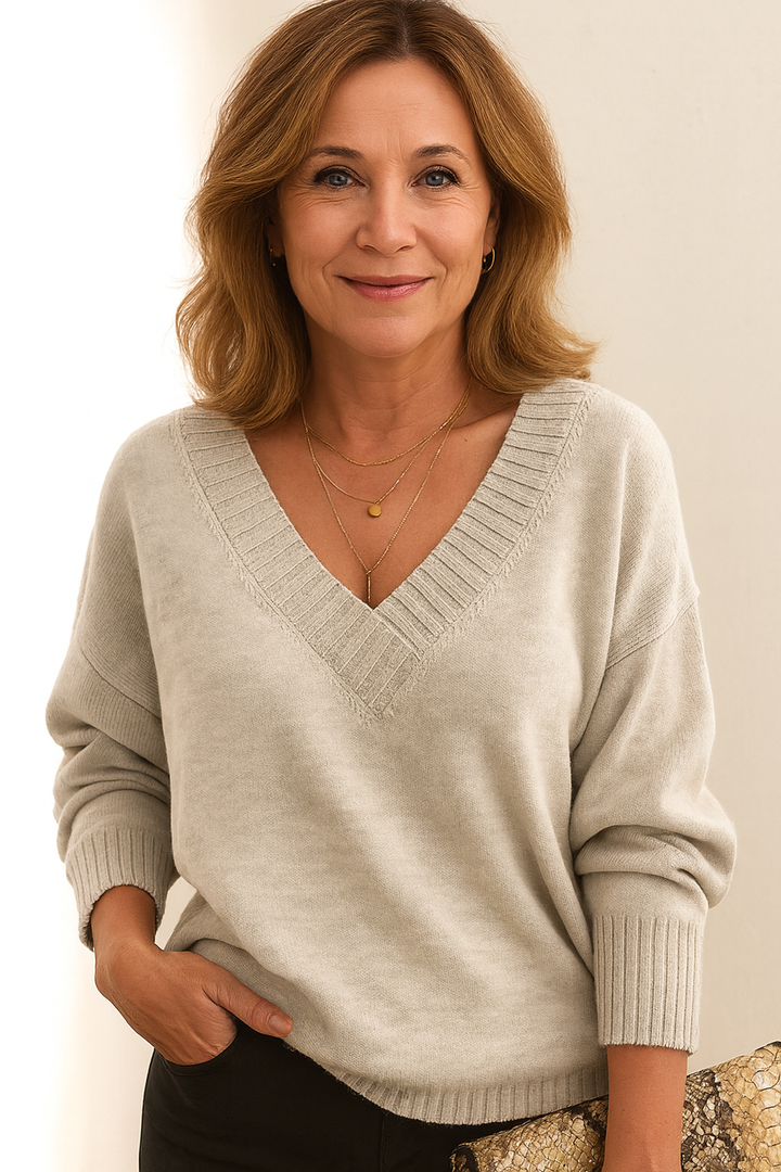 Warm women's V neck ribbed sweater. Relaxed fit, long sleeve, cozy for winter and fall fashion.