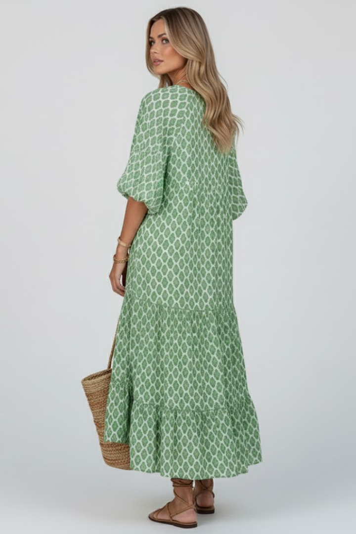 Summer women's maxi dress with a flattering V-neck, short sleeves, and a flowy silhouette. Ideal for casual comfort.