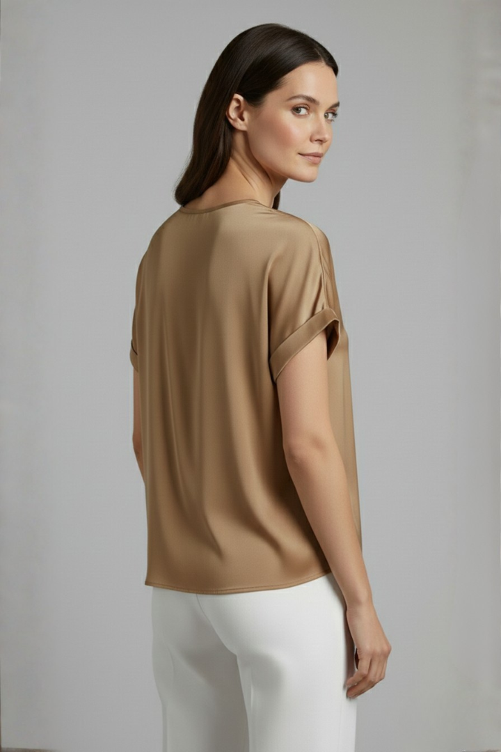 Dynamic shot of women's V-neck t-shirt, loose fit, short sleeves, perfect for active everyday comfort.