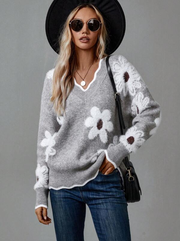 Charming women's v-neck floral appliqué sweater featuring unique textured detail, a fashion jumper.
