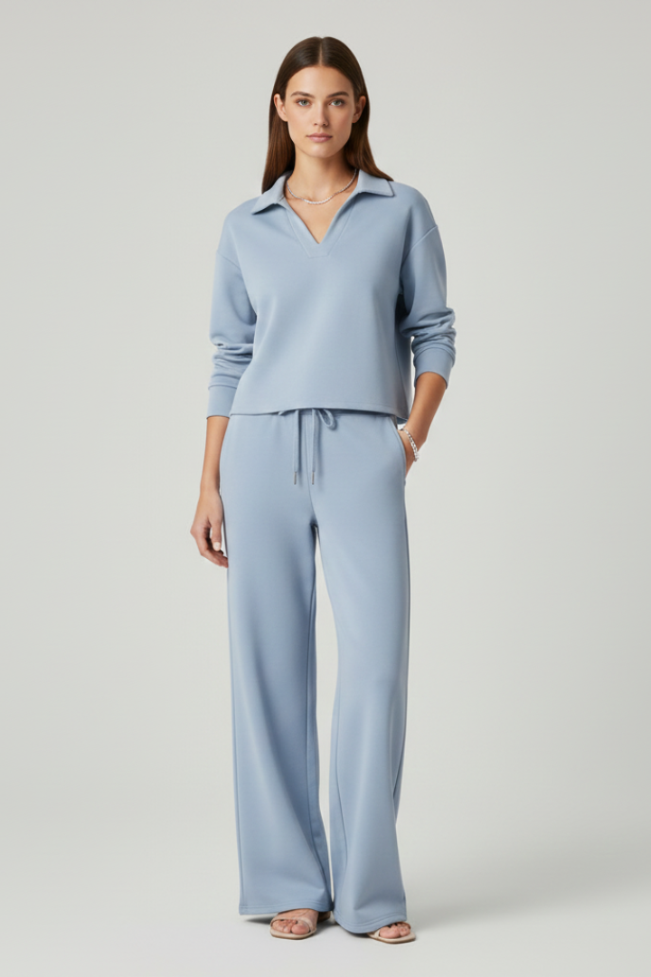 Comfortable women's V-neck top, part of a stylish two-piece outfit with wide-leg trousers, for versatile wear.