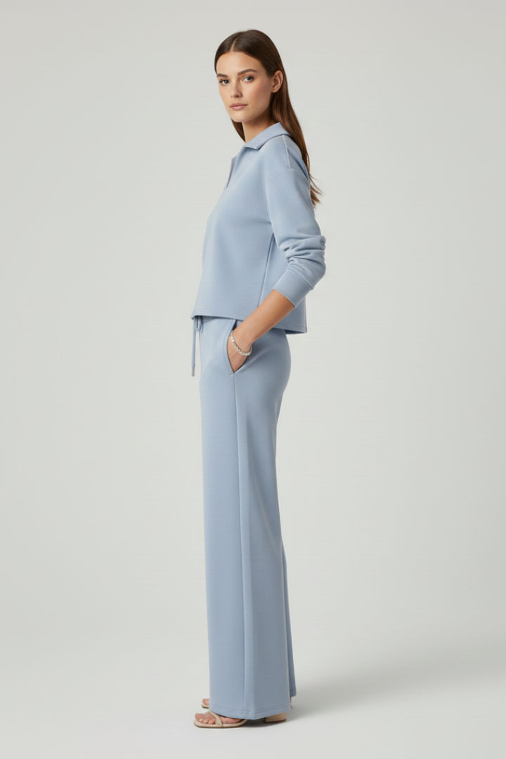 Women's V-neck two-piece set, including a cozy top and wide-leg trousers, perfect as a comfortable lounge outfit.
