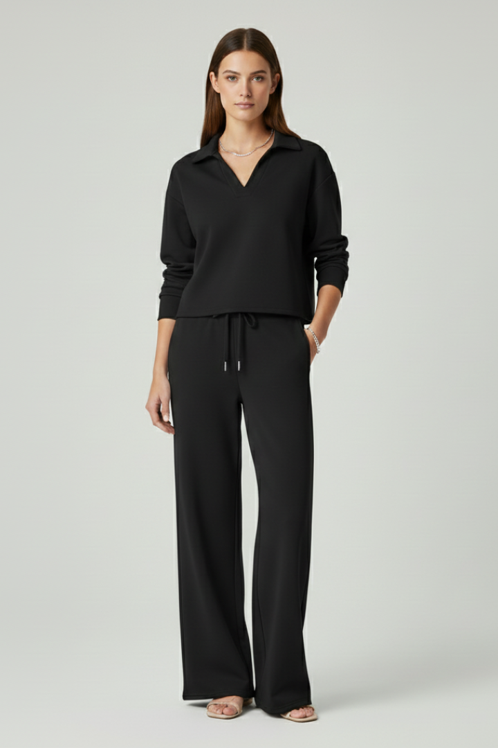 Relaxed women's casual wear: a V-neck top and comfortable wide-leg trousers in a stylish two-piece set.