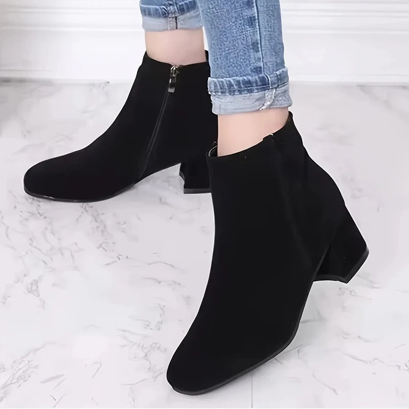 Comfortable brown women's ankle boots featuring block heel & side zip for versatile, chic everyday footwear.
