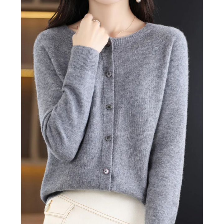 Blush pink button-front O-neck cardigan for women. Comfortable & chic knit for casual or office layering.