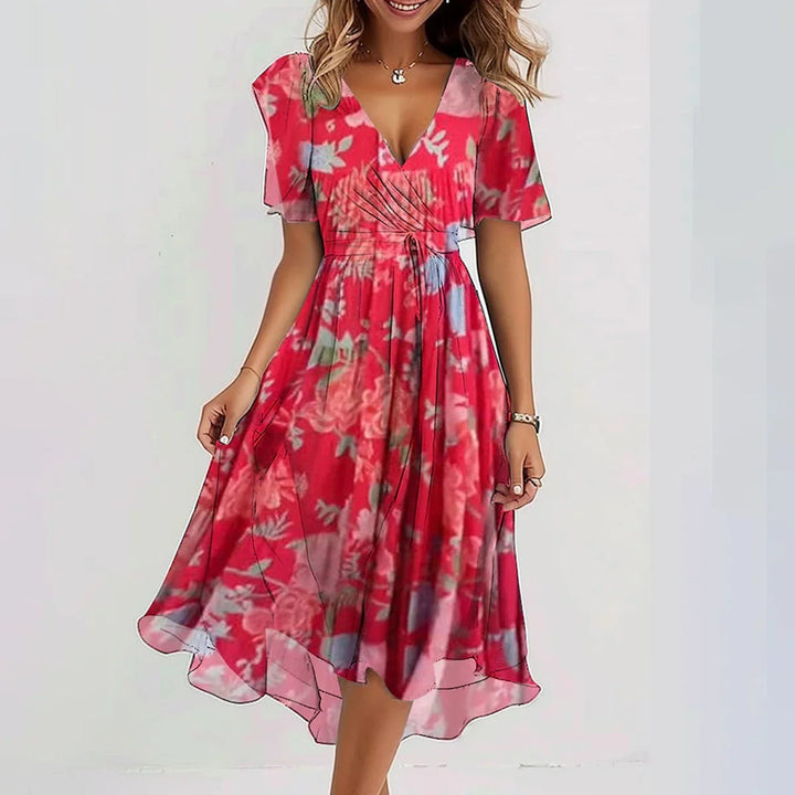 Casual flowy midi dress with vibrant abstract print for comfortable summer style.
