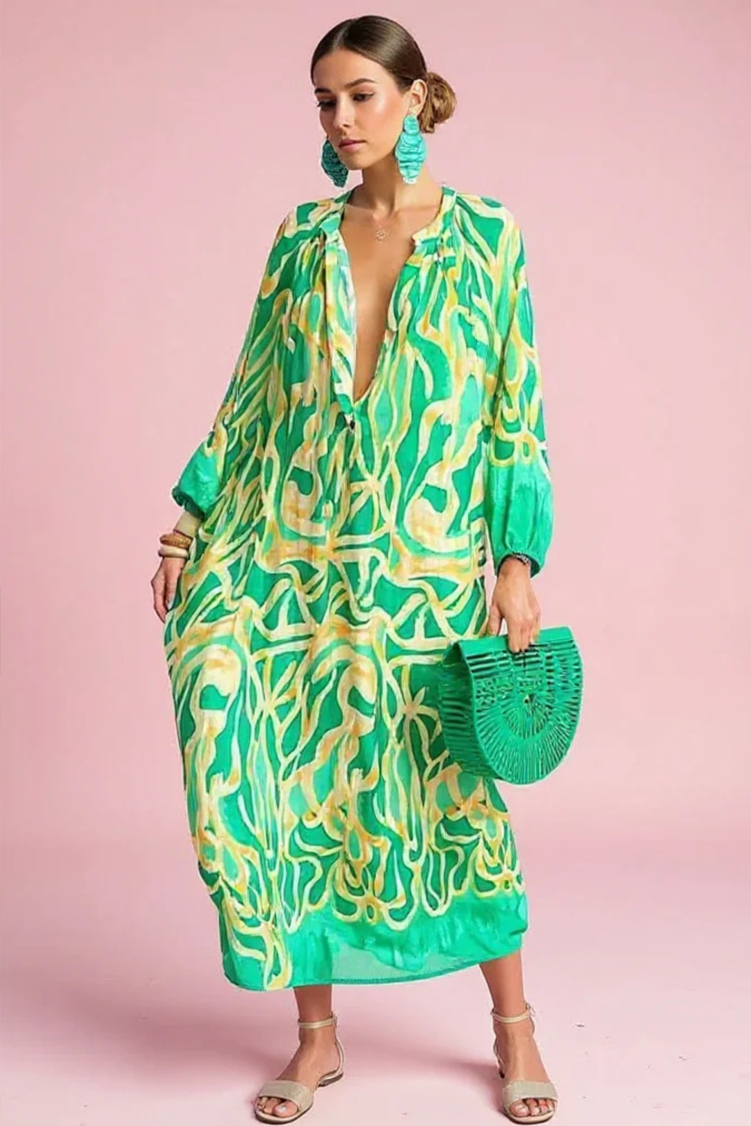 Women's vibrant abstract print V-neck kaftan maxi dress. Relaxed fit, perfect for resort or beach wear.