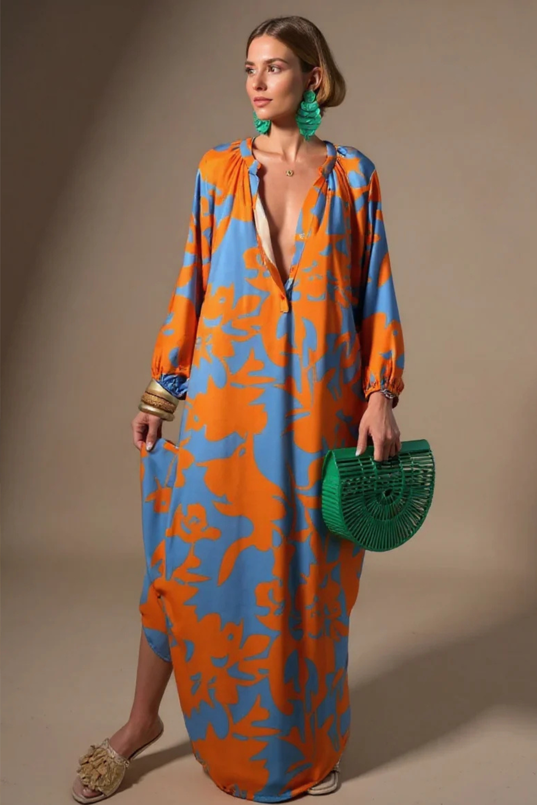 Stylish women's flowing abstract maxi kaftan dress with V-neck. Comfortable relaxed fit for summer fashion.