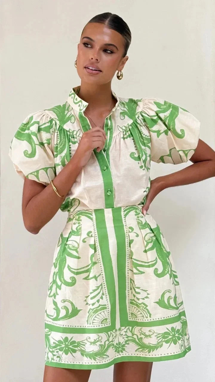 Women's puff sleeve floral mini cocktail dress, vibrant and chic.