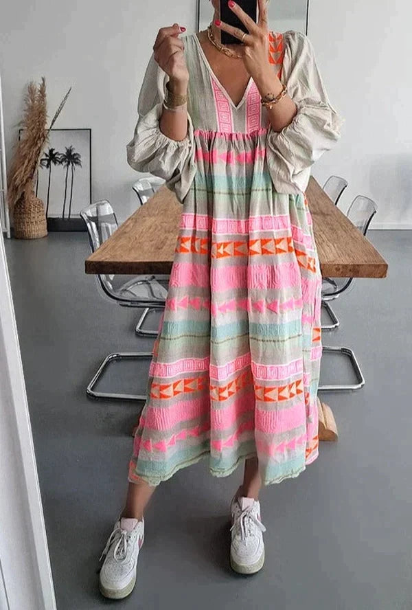 Women's vibrant gradient maxi summer dress. Flowing style, perfect for vacation or party. Sleeveless and elegant.