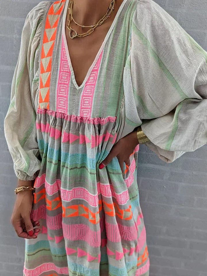 Flowy women's summer maxi dress with a vibrant gradient. Ideal for vacation, parties, or elegant casual wear.