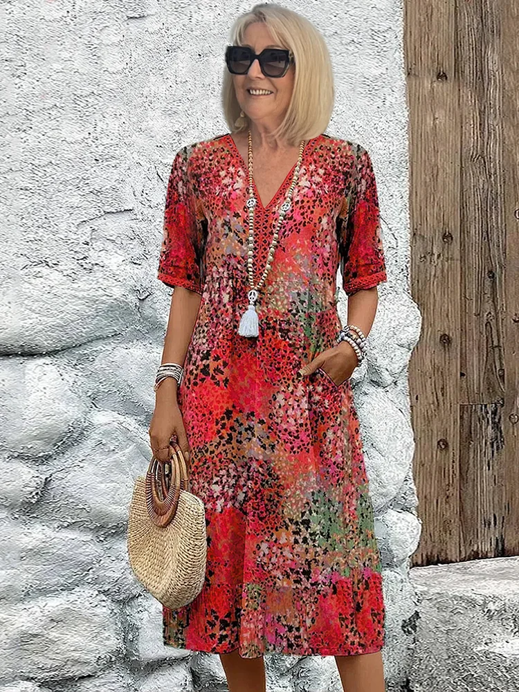 Women's vibrant print flowy midi dress for effortless casual or elegant style. Perfect spring & summer fashion.