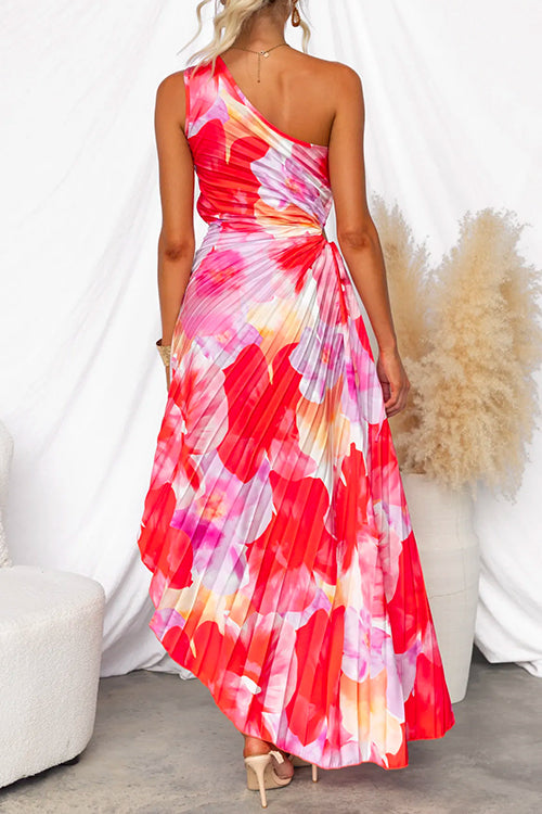 Stunning wedding guest one-shoulder gown, vibrant print & asymmetric hem for elegant evening occasions.