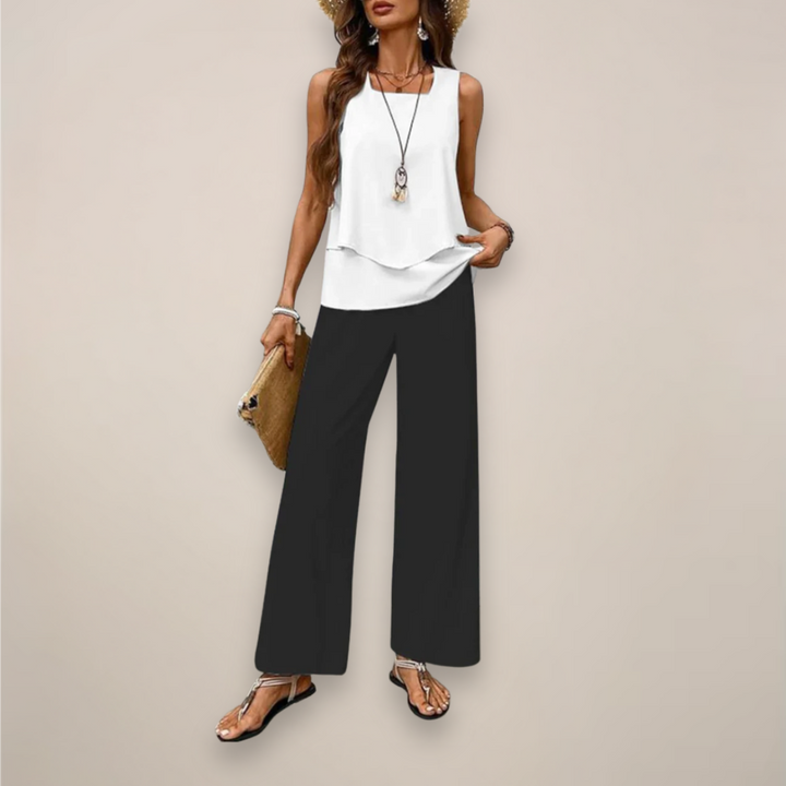 Detail of the wide-leg pants from a women's printed two-piece set, showcasing the flowy fabric and print.