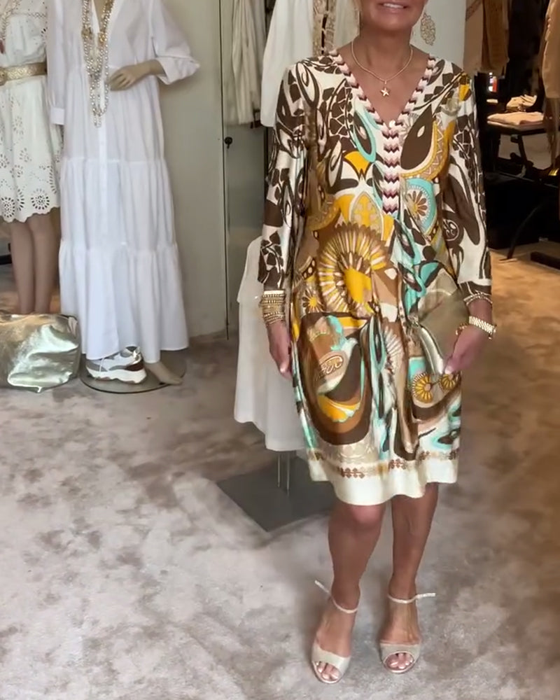 Retro-inspired women's sunburst print tunic dress, comfortable and stylish for everyday wear.