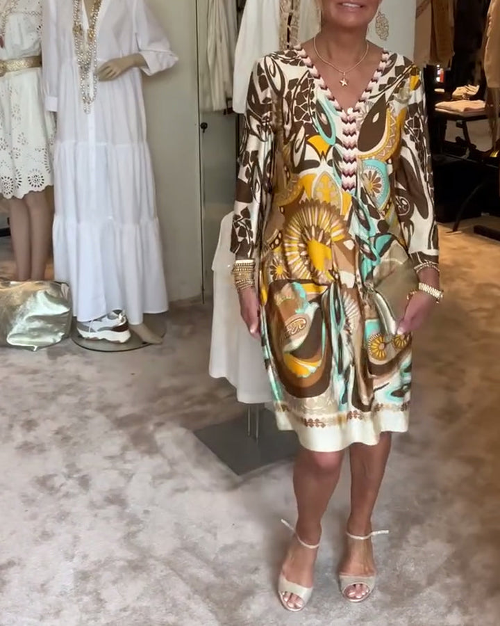 Retro-inspired women's sunburst print tunic dress, comfortable and stylish for everyday wear.