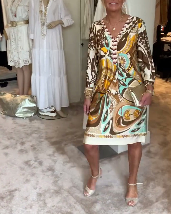 Vibrant sunburst patterned tunic dress for women, a versatile piece for spring, summer, or resort.