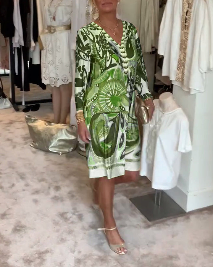 Women's sunburst print tunic dress with a relaxed fit, perfect for warm weather and effortless style.
