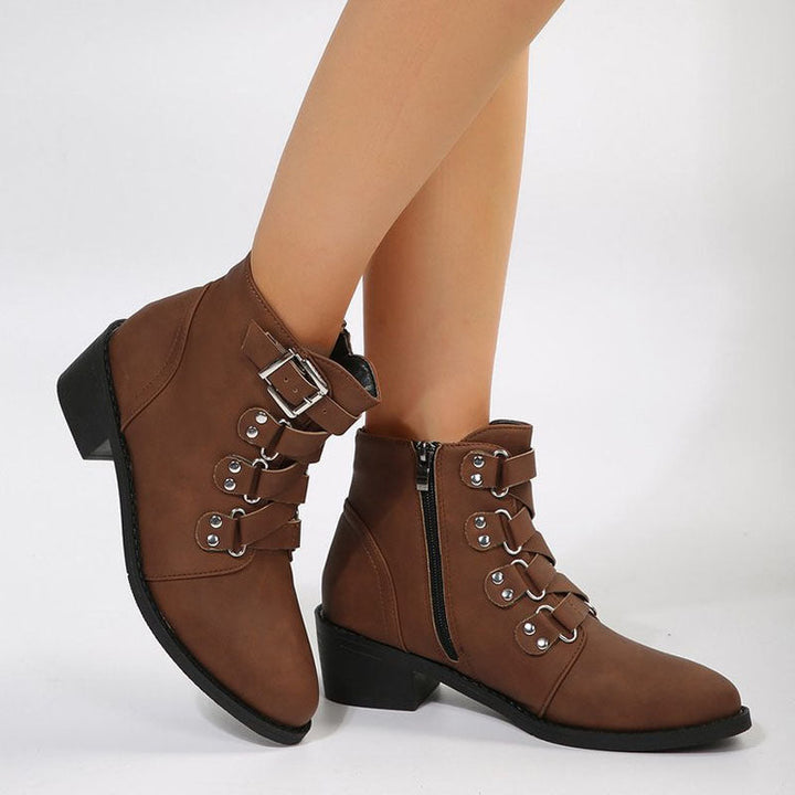 Stable block heel ankle boots for women. Elegant vintage design in black.