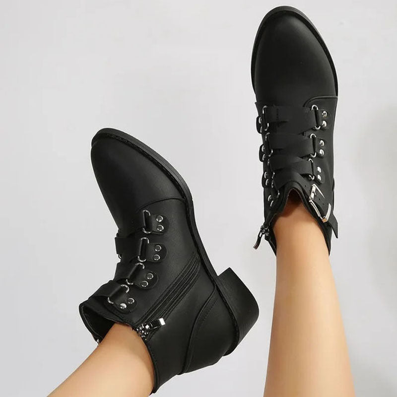 Fashionable black women's block heel ankle boots. Vintage look with stable comfort.