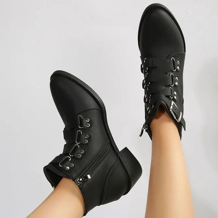 Fashionable black women's block heel ankle boots. Vintage look with stable comfort.