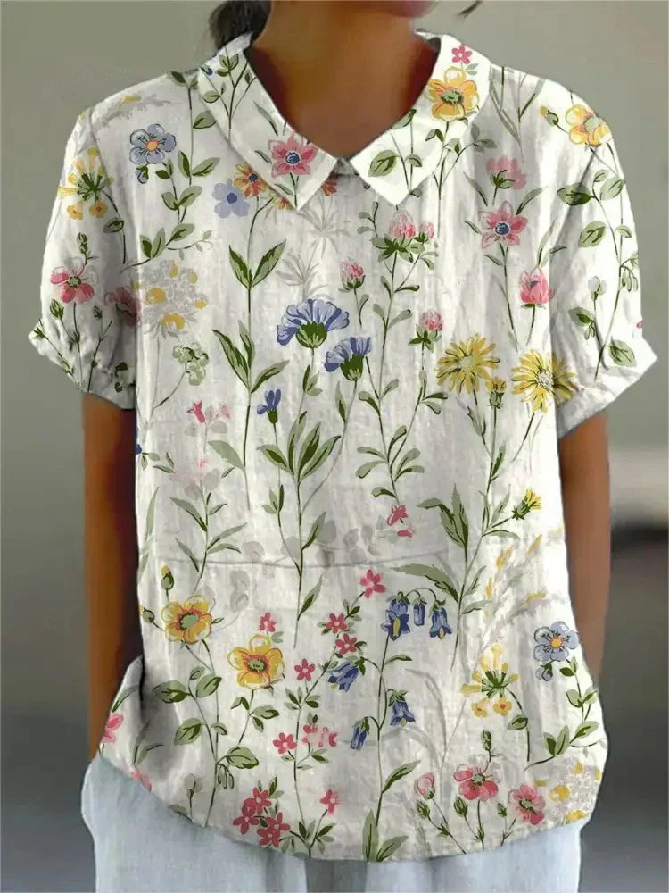 Elegant short sleeve floral top for women, featuring intricate embroidery & vintage style for summer.