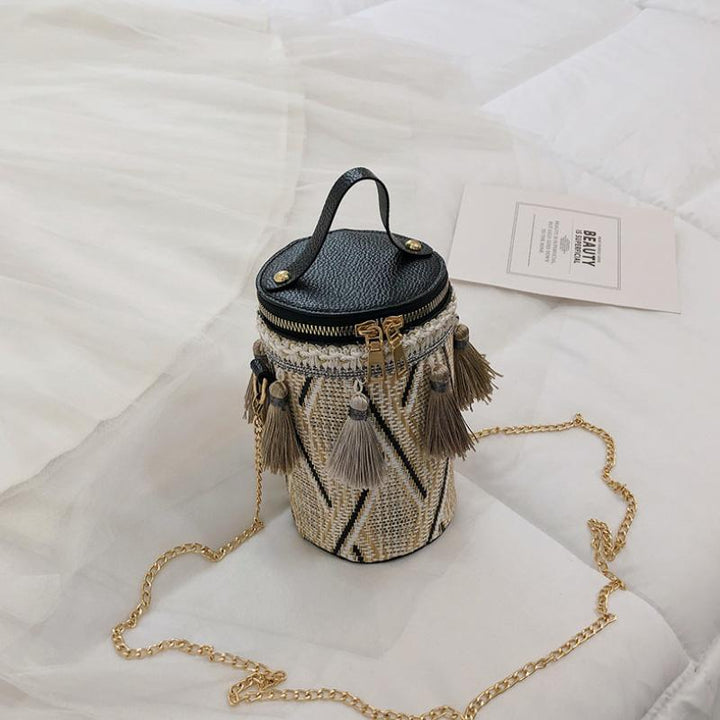 Fashionable women's accessories: a chic bucket bag and comfortable floral embroidered socks.