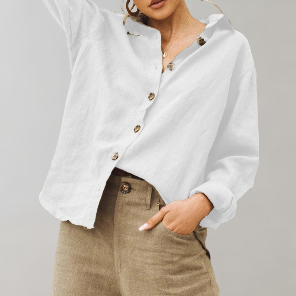 Women's vintage inspired relaxed fit blouse with classic collar. Long sleeve button-up for versatile chic style.