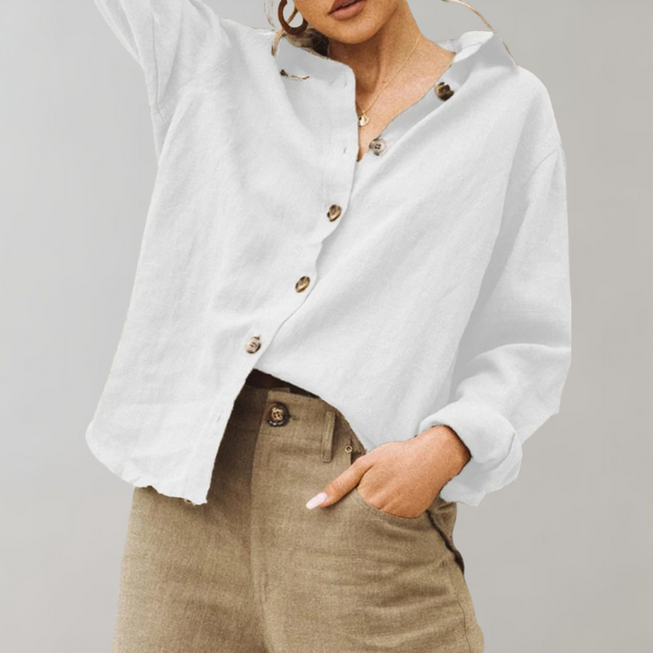 Women's vintage inspired relaxed fit blouse with classic collar. Long sleeve button-up for versatile chic style.