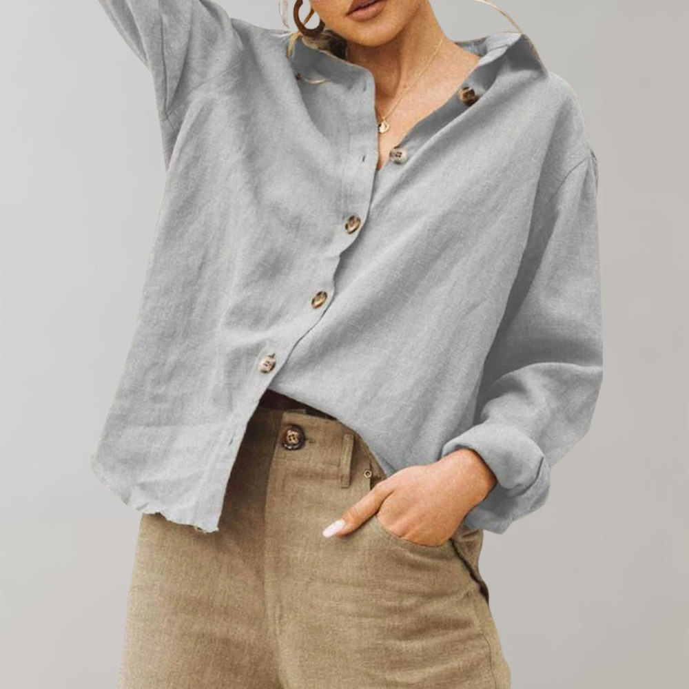 Comfortable women's relaxed fit button-up blouse. Features vintage style, classic collar, and long sleeves.