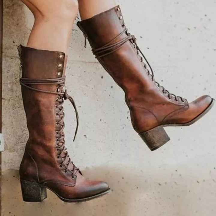 Close-up of a women's vintage high-heel boot showcasing intricate lace-up details and quality craftsmanship.