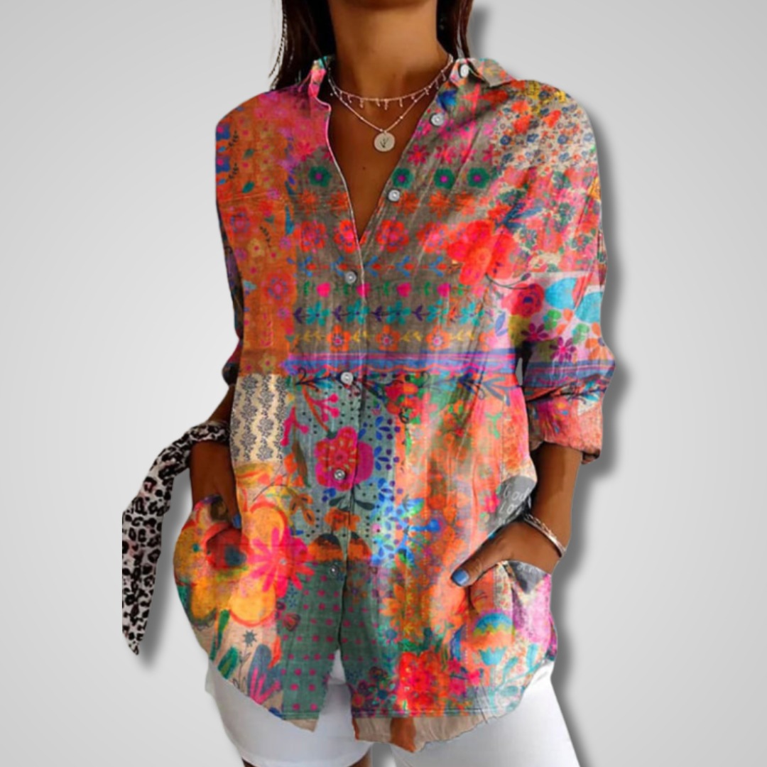 Women's vintage printed button-down v-neck blouse. Stylish long sleeve top for casual wear.