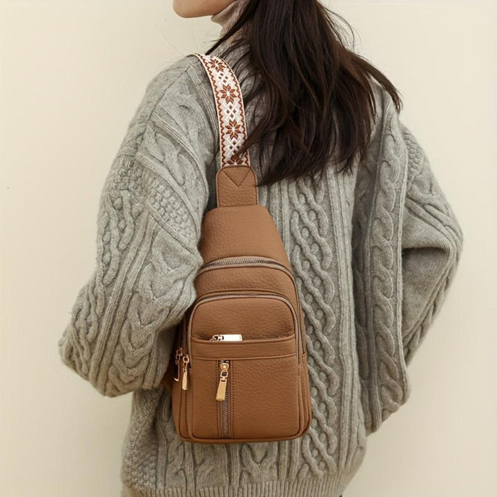 Black retro leather chest crossbody purse for women, adjustable strap.