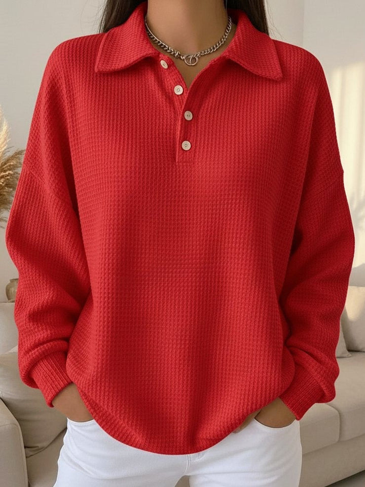 Stylish women's oversized waffle knit henley pullover. Relaxed fit, long sleeve for smart casual autumn outfits.