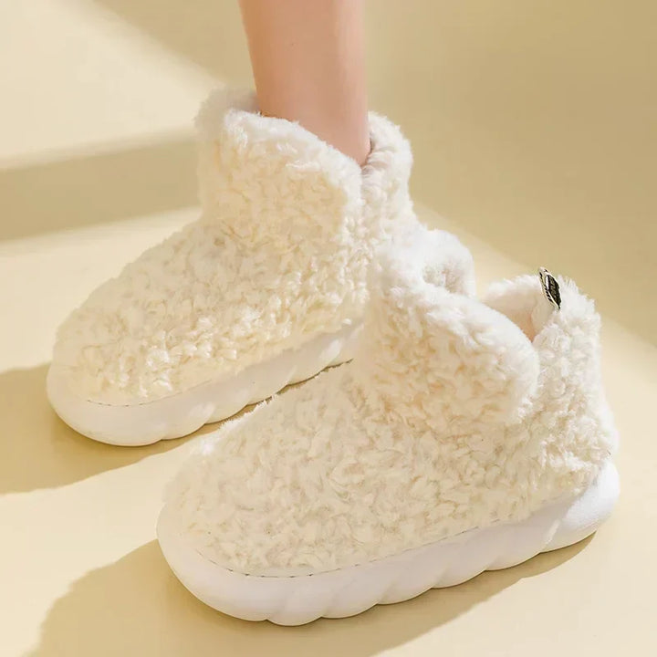 Comfortable women's warm slippers. Stylish indoor/outdoor footwear with soft plush for cold weather home wear.