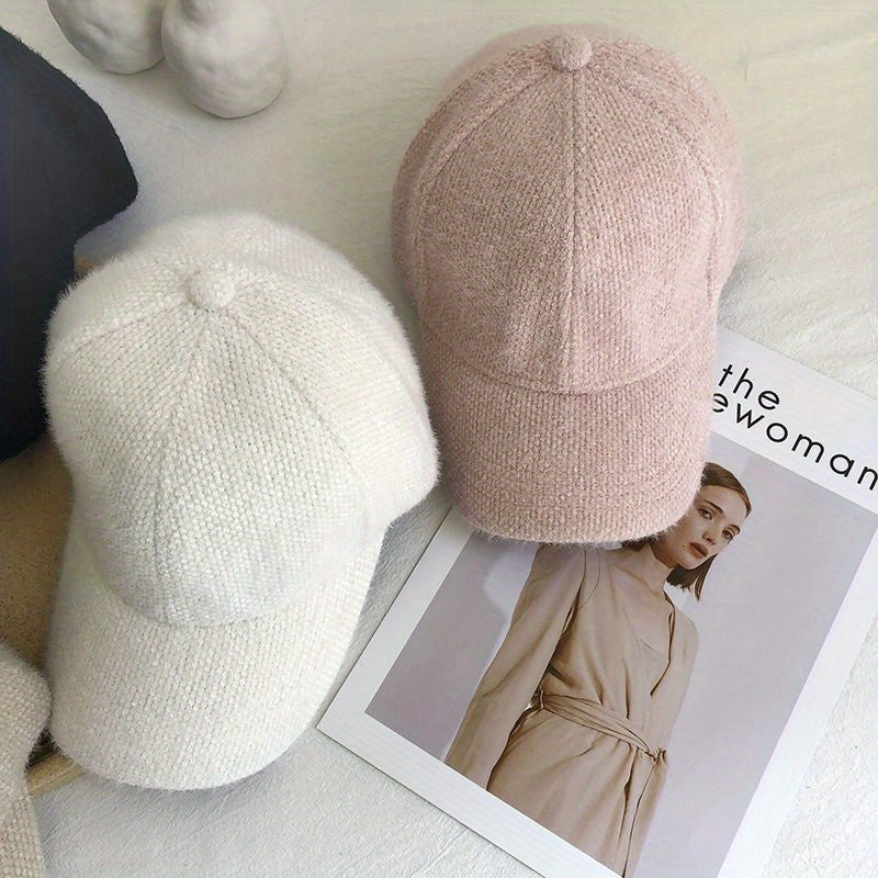 Autumn/winter women's baseball cap with cozy faux fur, essential headwear for colder months.