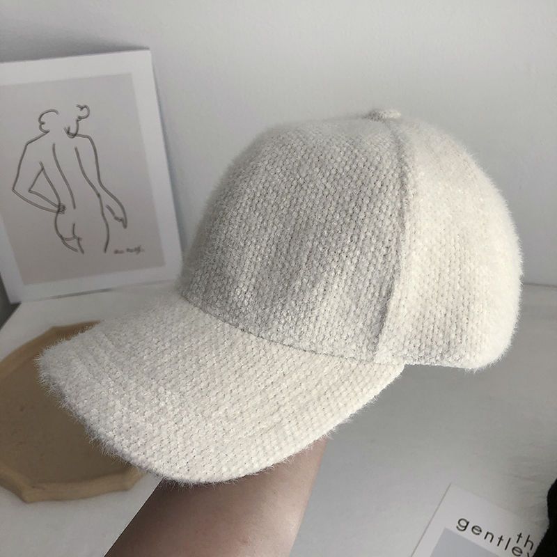 Elegant faux fur women's baseball cap, an acrylic blend for ultimate warmth and style.