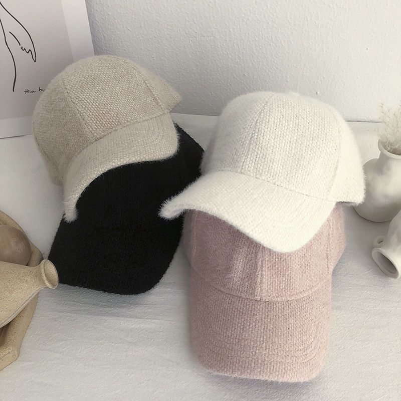 Trendy women's warm faux fur baseball cap, a fashionable choice for staying cozy in cold weather.