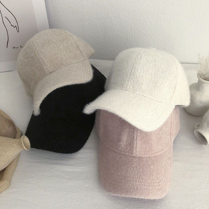 Trendy women's warm faux fur baseball cap, a fashionable choice for staying cozy in cold weather.