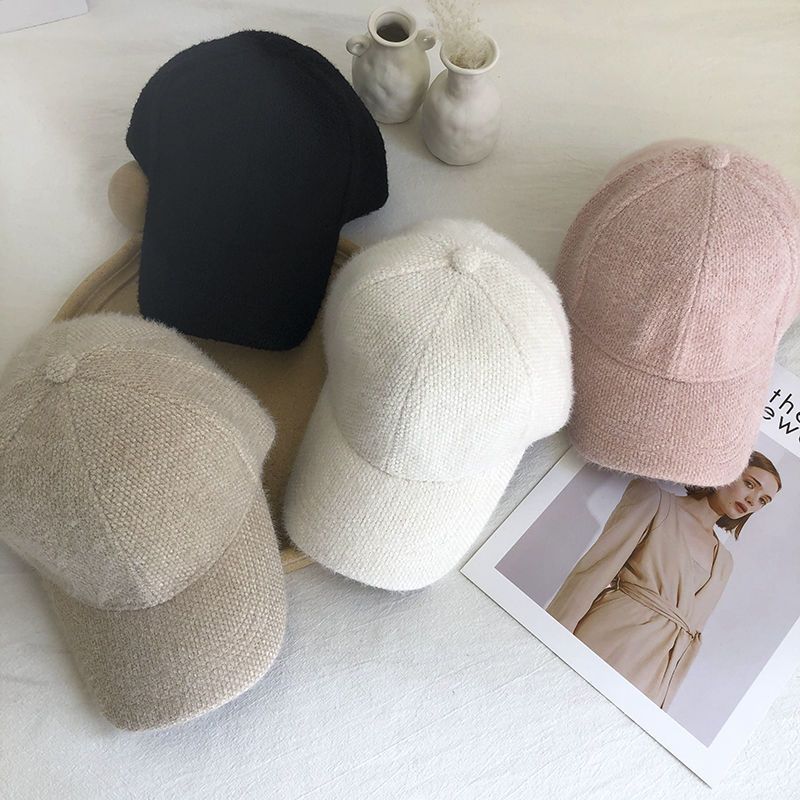 Adjustable faux fur baseball cap for women, ensuring a warm and comfortable fit outdoors.