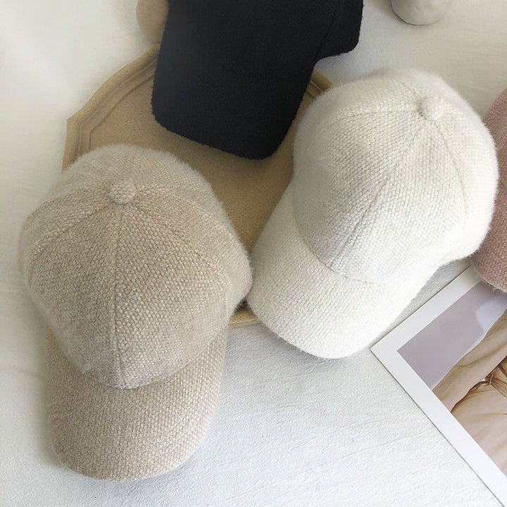 Acrylic women's baseball cap featuring luxurious faux fur for winter warmth and elegance.