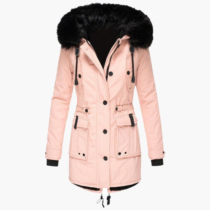 Close-up of the faux fur hood on a women's warm winter coat, soft and cozy for cold weather.