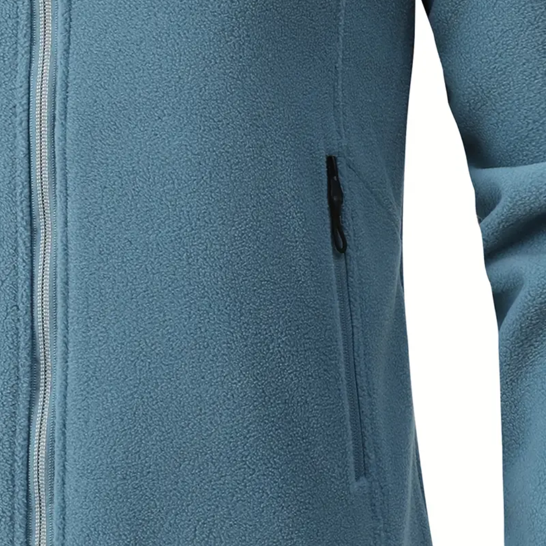 Close-up of women's warm plush-lined fleece jacket texture. Soft, cozy outerwear for autumn & winter activities.
