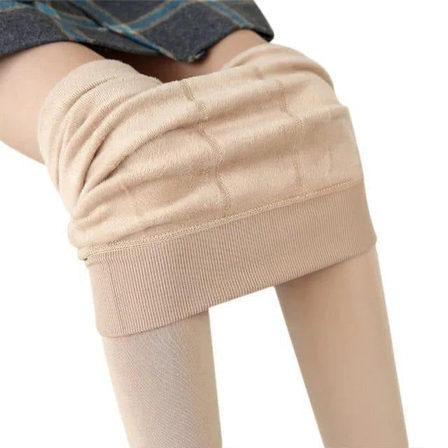 Flexible, stretchy women's thermal leggings offer full movement & warmth for winter activities. High-waist fit.