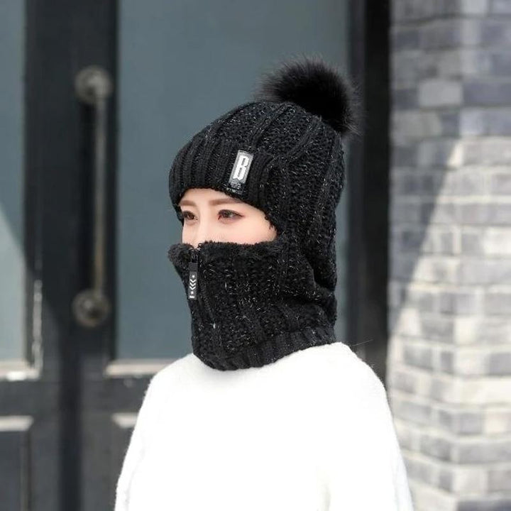 Display of a women's warm winter hat with matching scarf, showcasing a complete cozy set