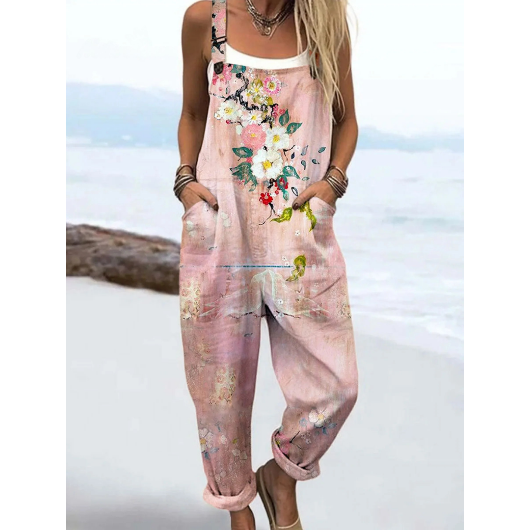 Women's watercolour floral boho jumpsuit with adjustable straps, ideal for casual summer wear and travel.